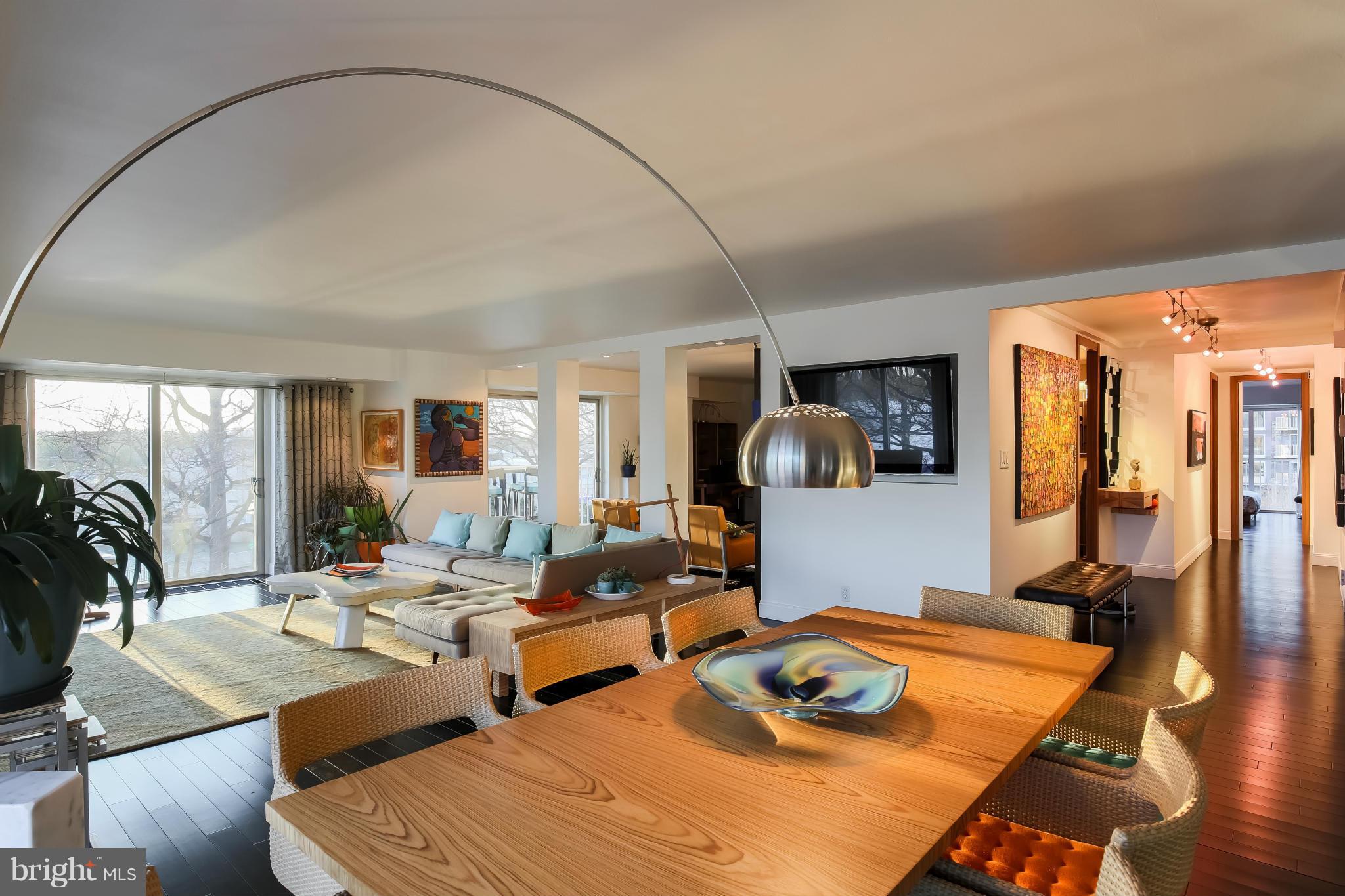 550 N Street Southwest, Unit S201 Washington, DC 20024 - Photo 1 of 30 a living room with couches and a table with wooden floor