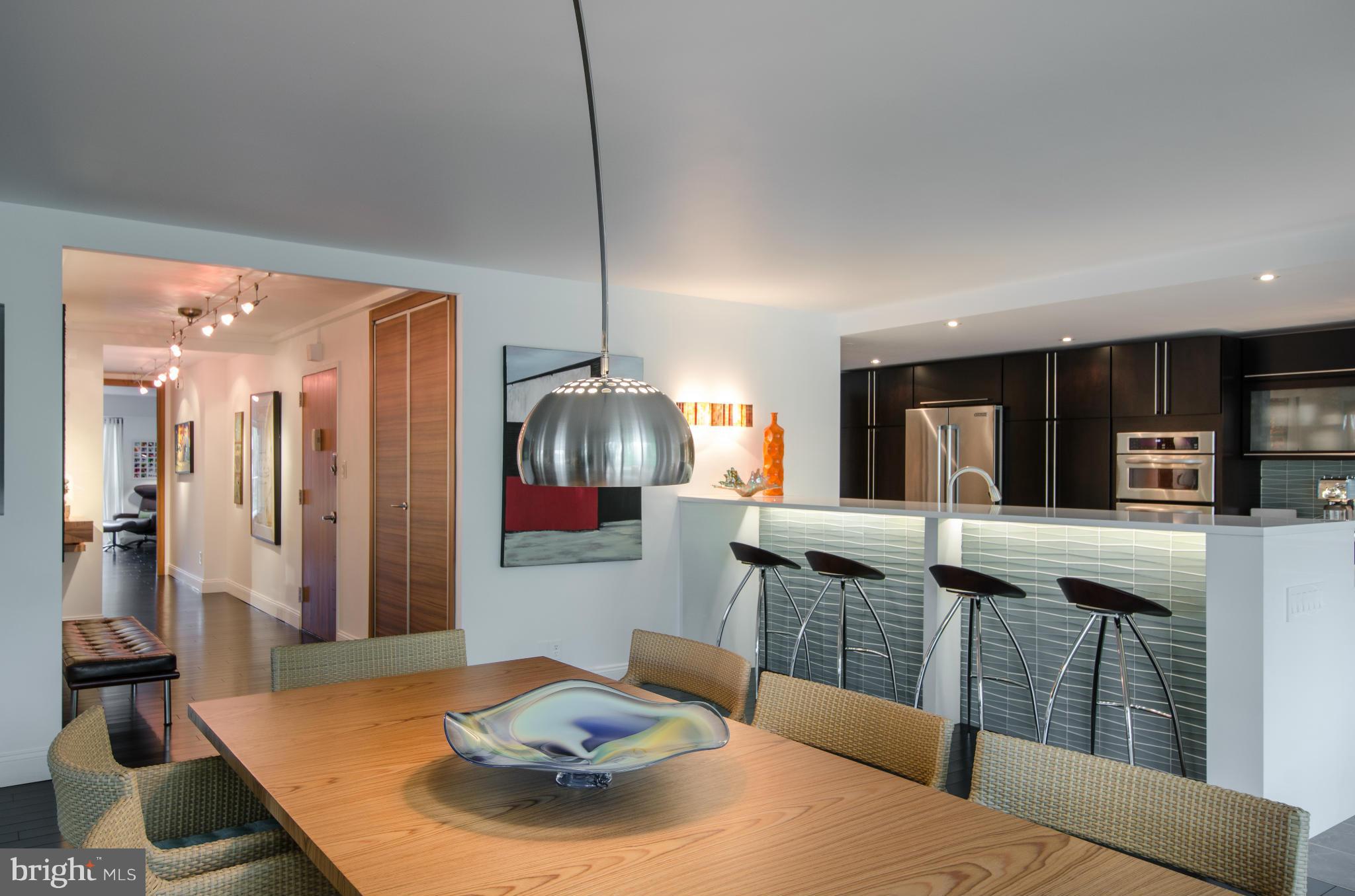 550 N Street Southwest, Unit S201 Washington, DC 20024 - Photo 2 of 30 a kitchen with stainless steel appliances granite countertop a sink and a refrigerator