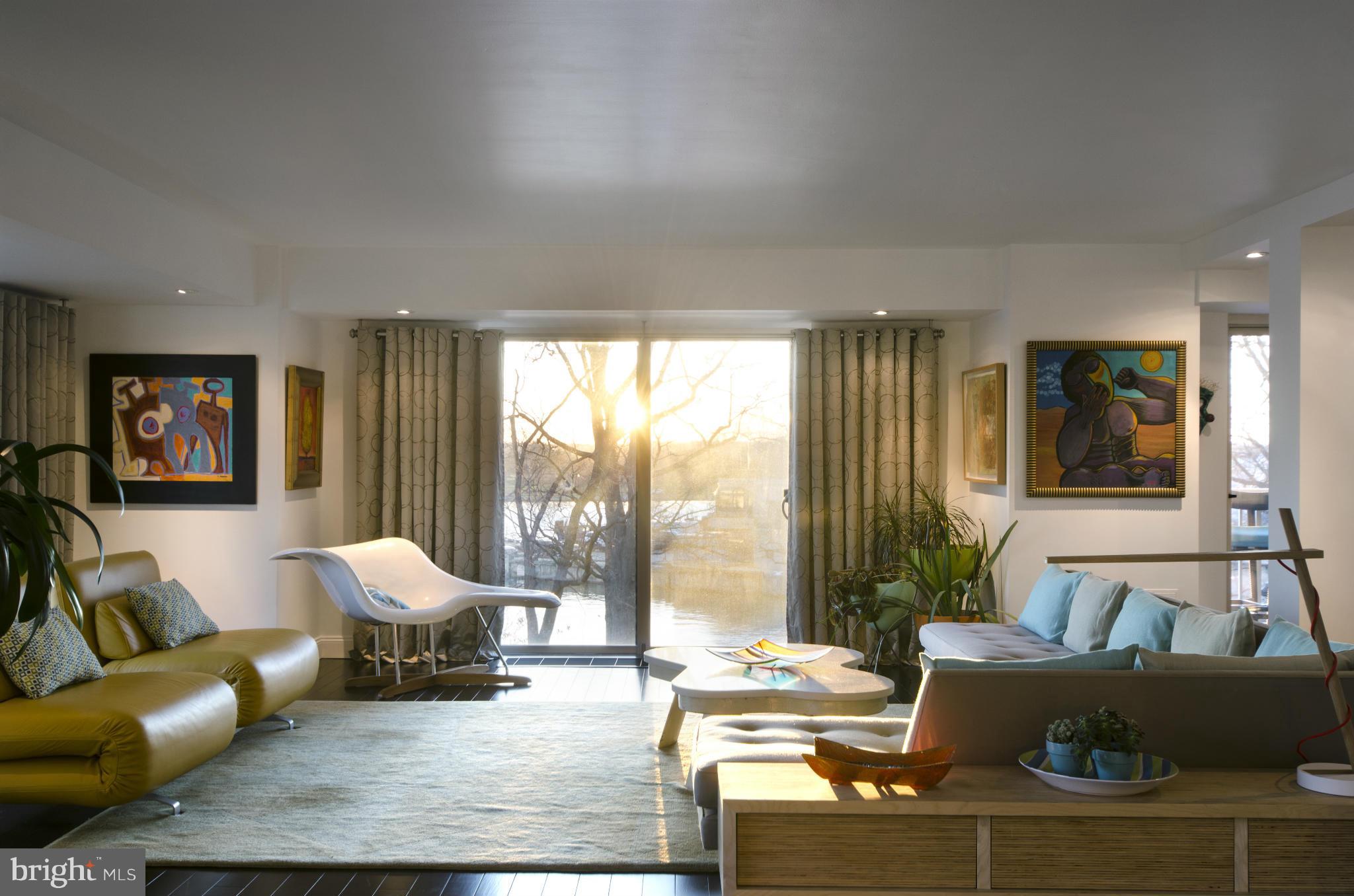 550 N Street Southwest, Unit S201 Washington, DC 20024 - Photo 11 of 30 a living room with furniture and a large window