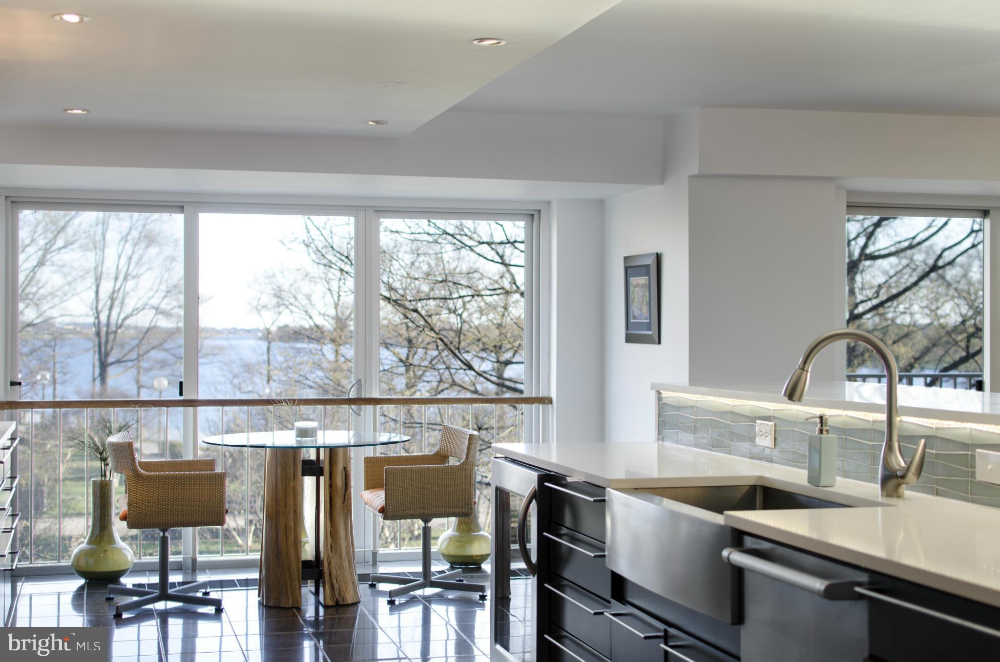 550 N Street Southwest, Unit S201 Washington, DC 20024 - Photo 5 of 30 a view of a kitchen with furniture and wooden floor