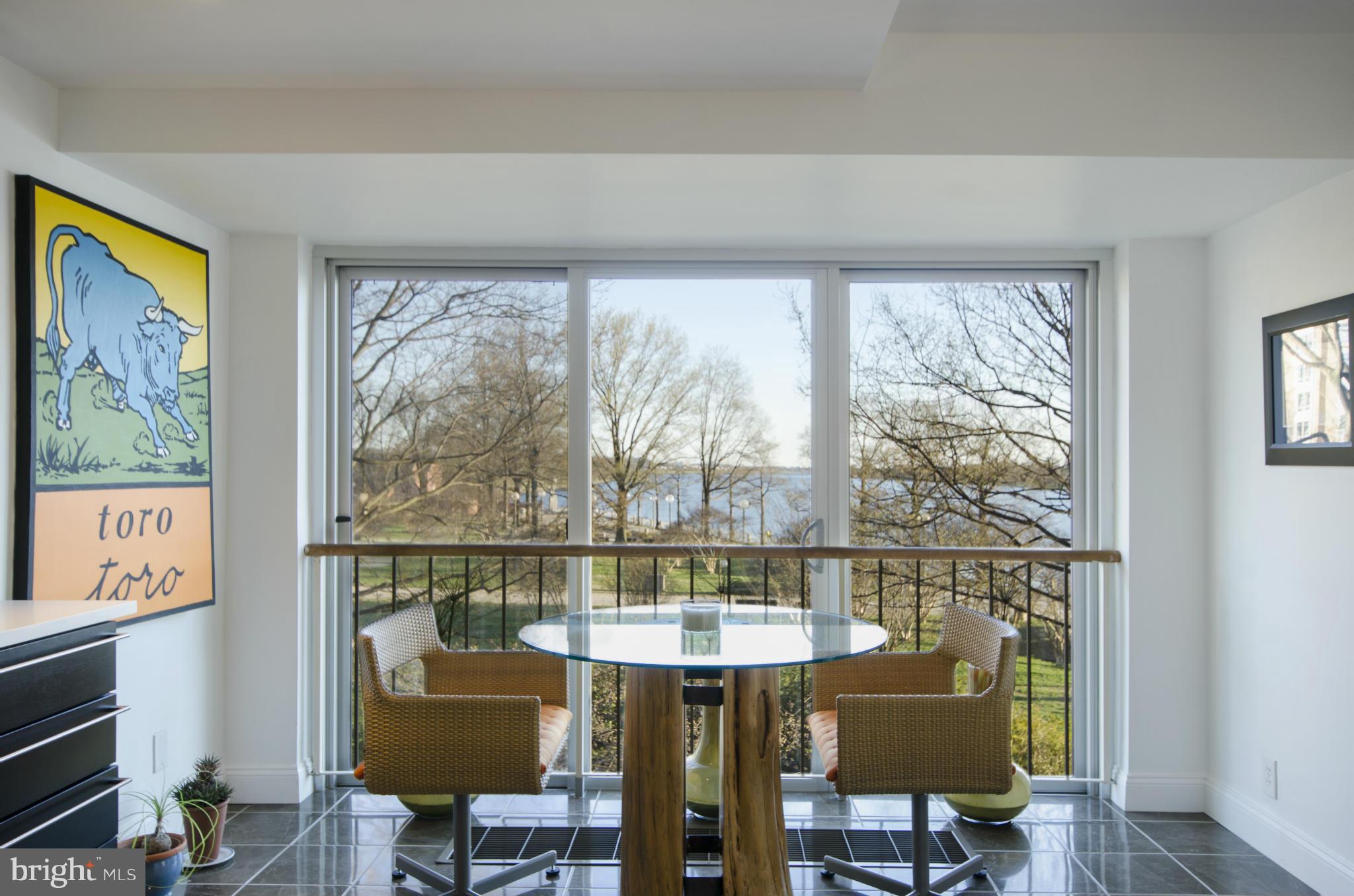 550 N Street Southwest, Unit S201 Washington, DC 20024 - Photo 6 of 30 a view of a dining room with furniture window and wooden floor