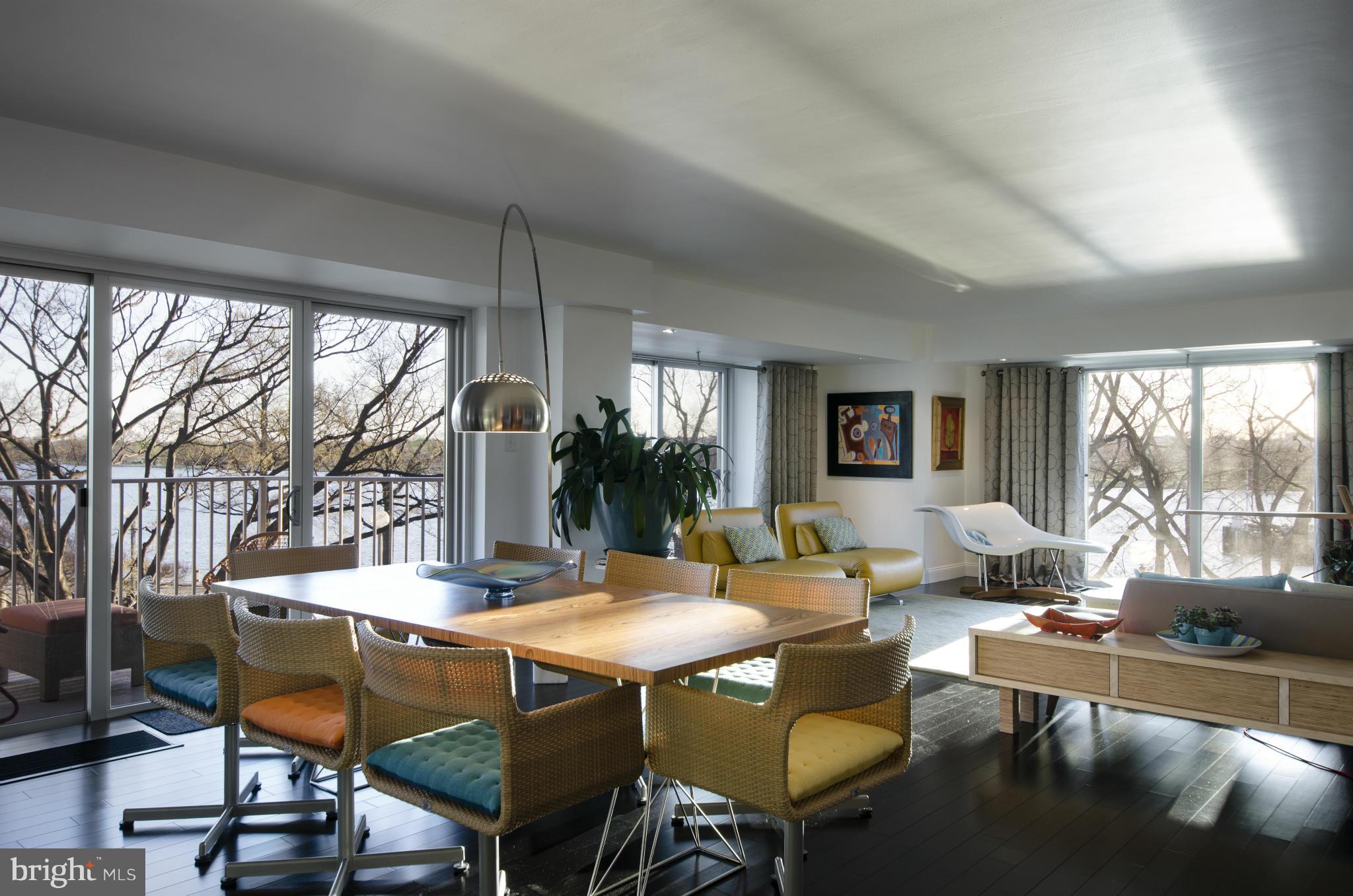 550 N Street Southwest, Unit S201 Washington, DC 20024 - Photo 8 of 30 a living room with furniture a rug and a large window