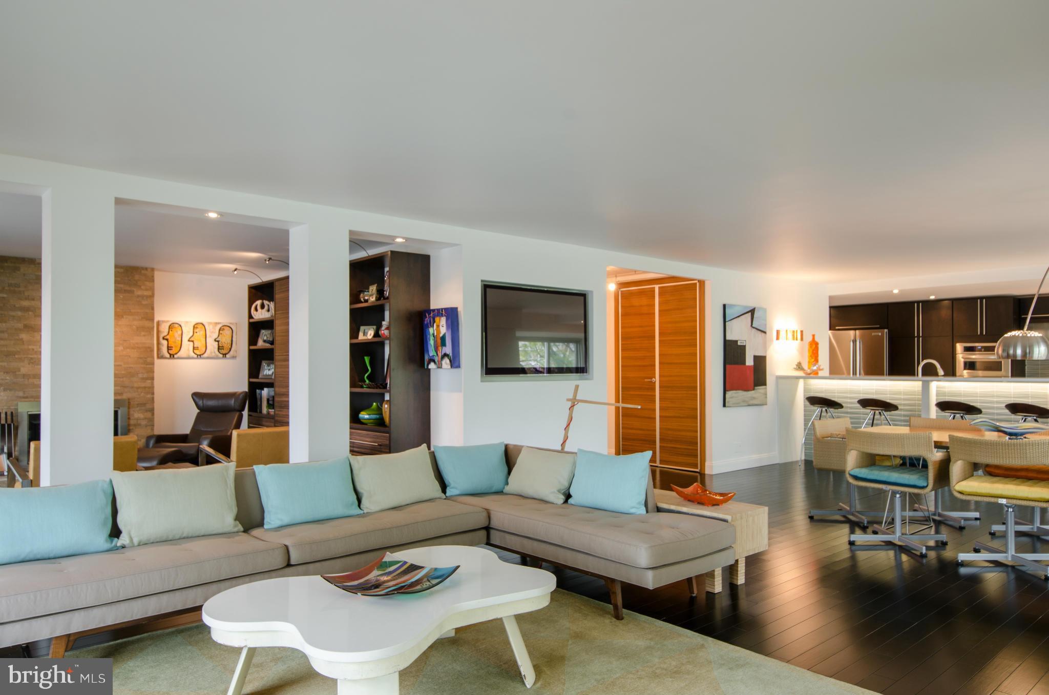 550 N Street Southwest, Unit S201 Washington, DC 20024 - Photo 9 of 30 a living room with furniture and wooden floor