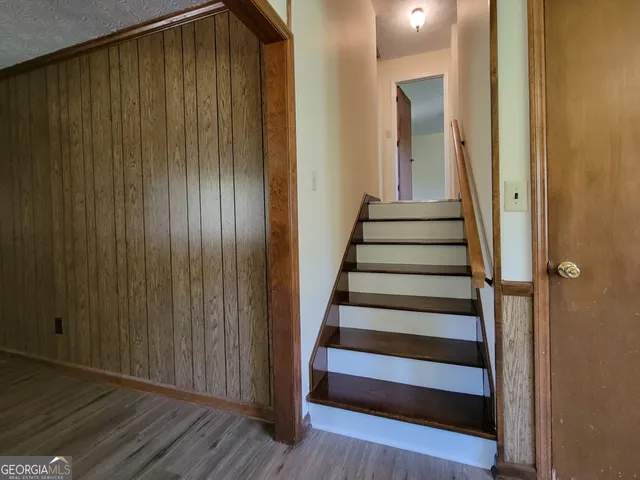 a view of entryway with wooden floor