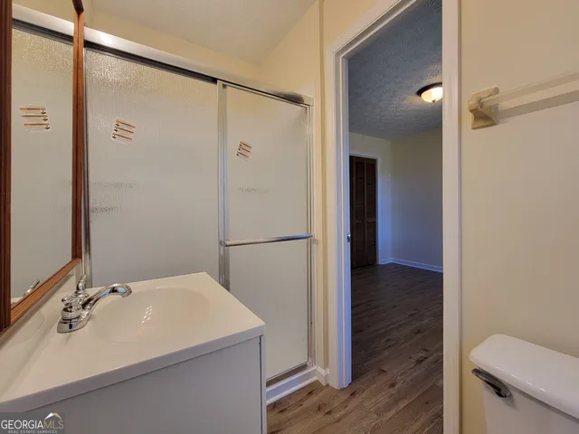 a bathroom with a sink and mirror
