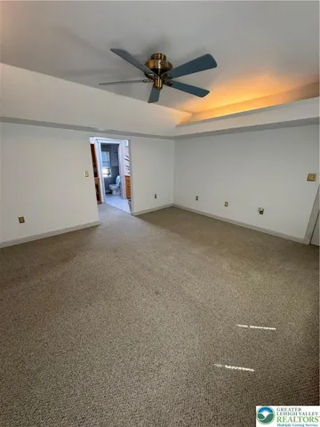 a room with stainless steel appliances kitchen island a stove and a sink