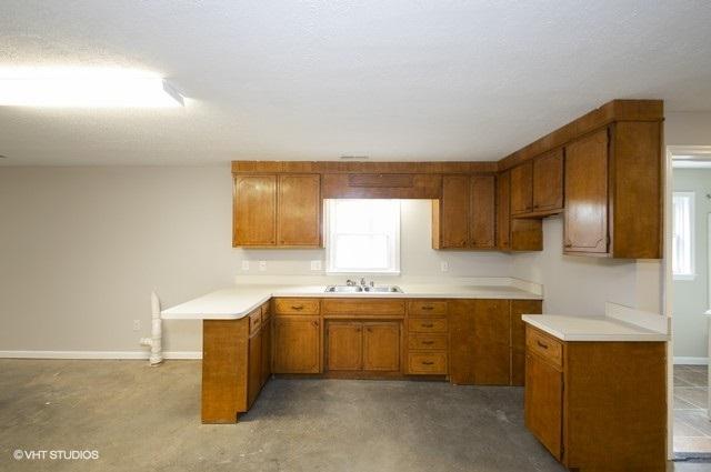 321 Pernello Road Ferrum, VA 24088 - Photo 17 of 25 a kitchen with a sink cabinets and window