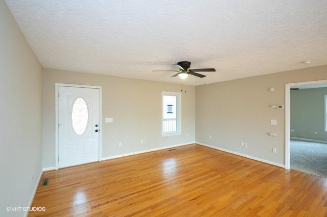 321 Pernello Road Ferrum, VA 24088 - Photo 4 of 25 a view of an empty room with wooden floor and window