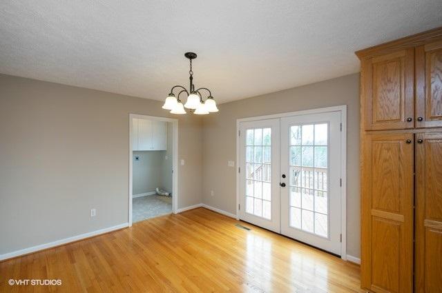 321 Pernello Road Ferrum, VA 24088 - Photo 6 of 25 a view of a livingroom with a chandelier fan and windows