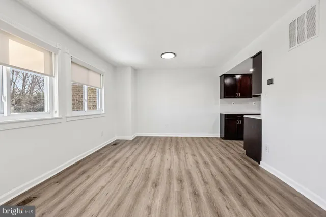 a bathroom with a toilet and a shower curtain