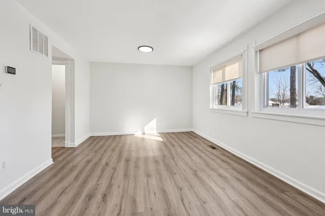 a bathroom with a sink vanity toilet and shower