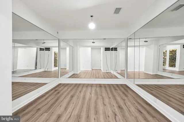 a white bath tub sitting next to a white toilet