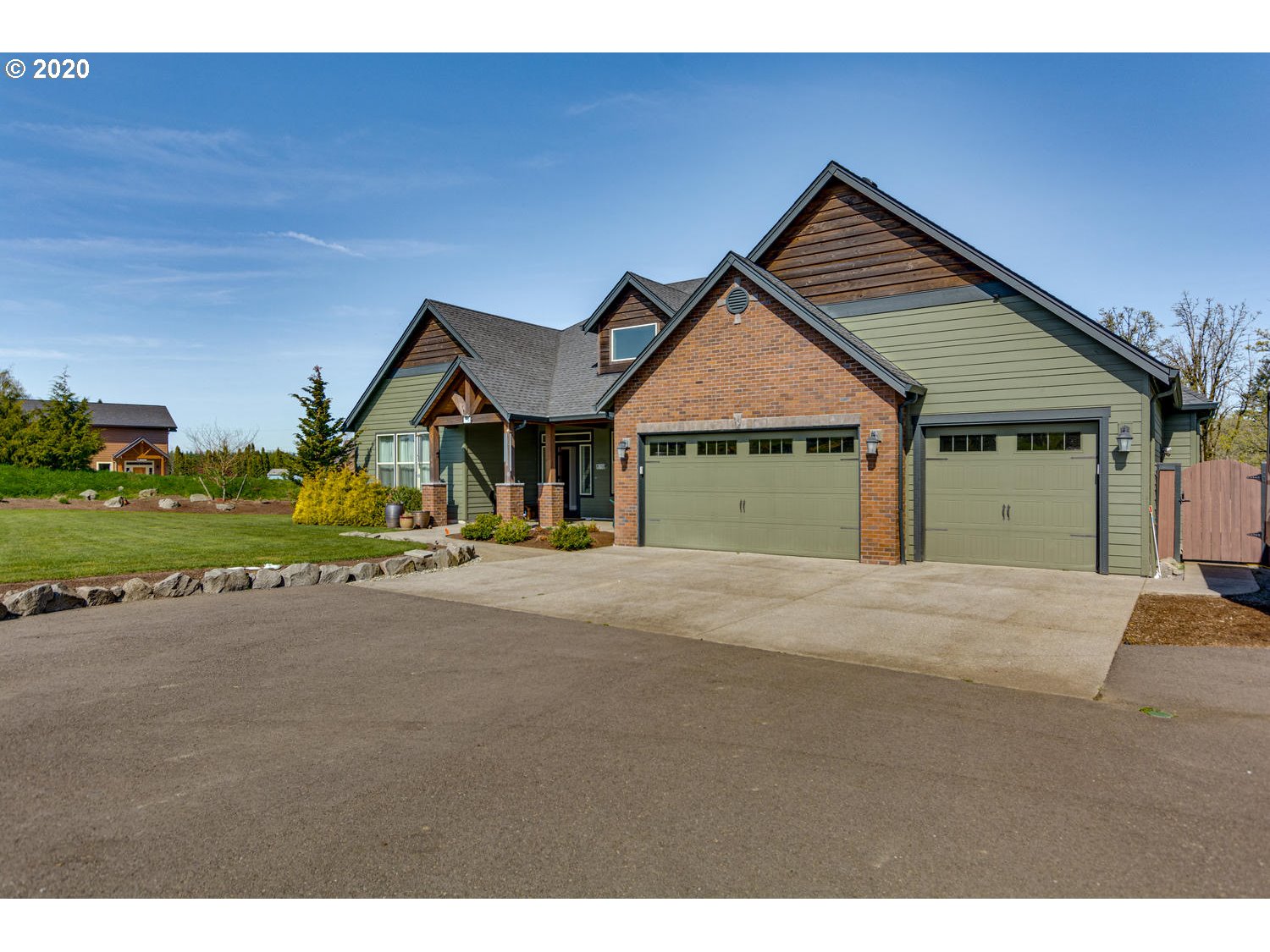 1704 Northwest 179th Street Ridgefield, WA 98642 - Photo 1 of 28 a front view of a house with a yard and garage