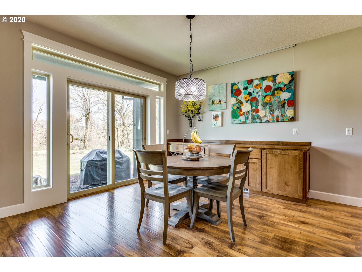 1704 Northwest 179th Street Ridgefield, WA 98642 - Photo 12 of 28 a view of a dining room with furniture wooden floor and a chandelier