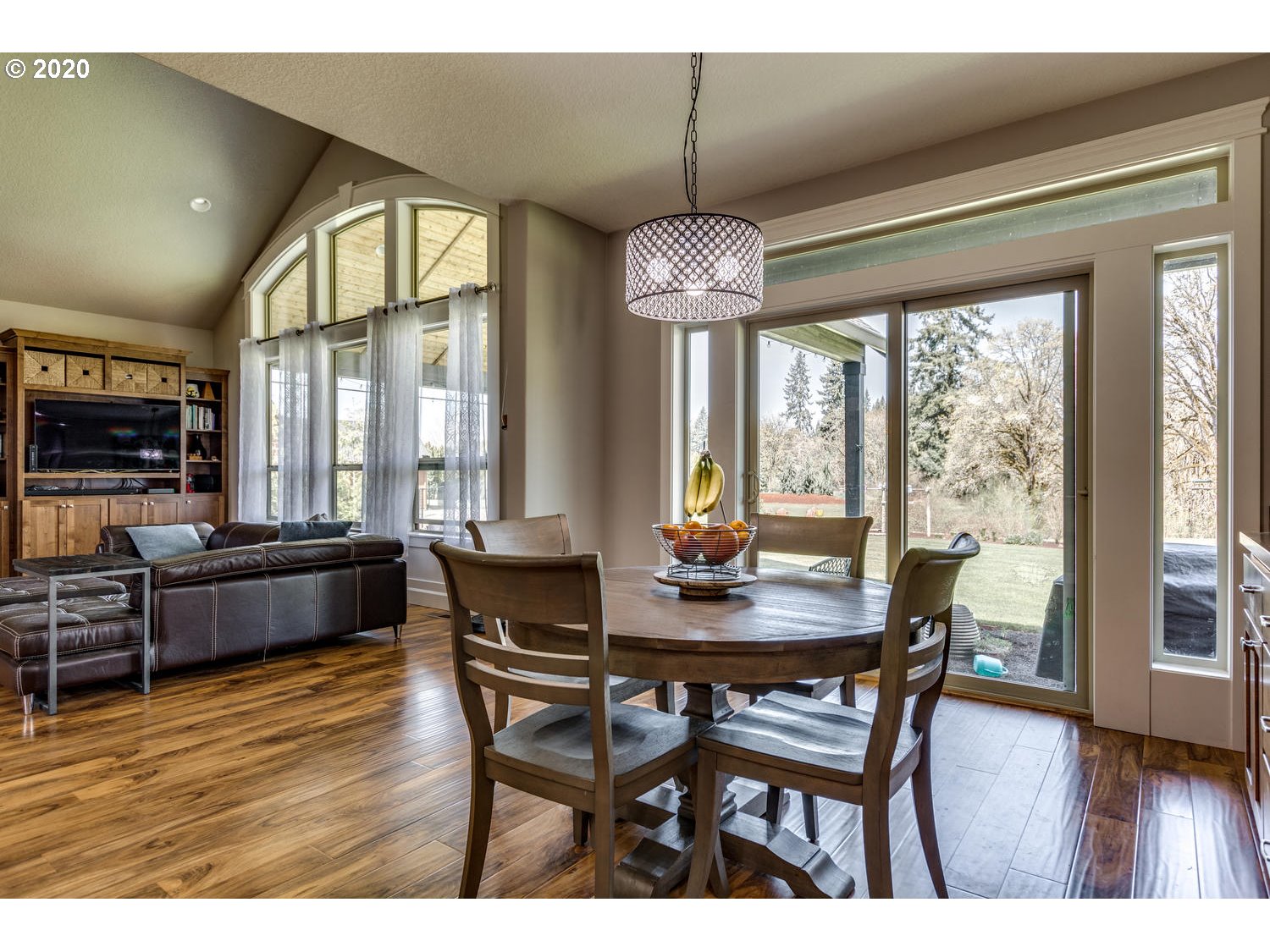 1704 Northwest 179th Street Ridgefield, WA 98642 - Photo 13 of 28 a view of a dining room with furniture window and wooden floor