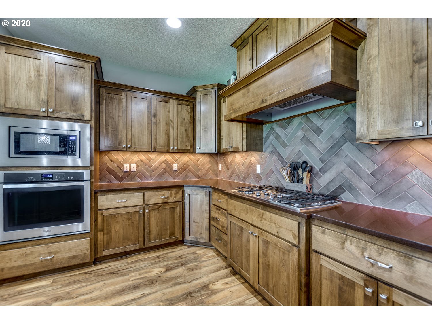 1704 Northwest 179th Street Ridgefield, WA 98642 - Photo 15 of 28 a kitchen with stainless steel appliances granite countertop a stove a sink and a microwave