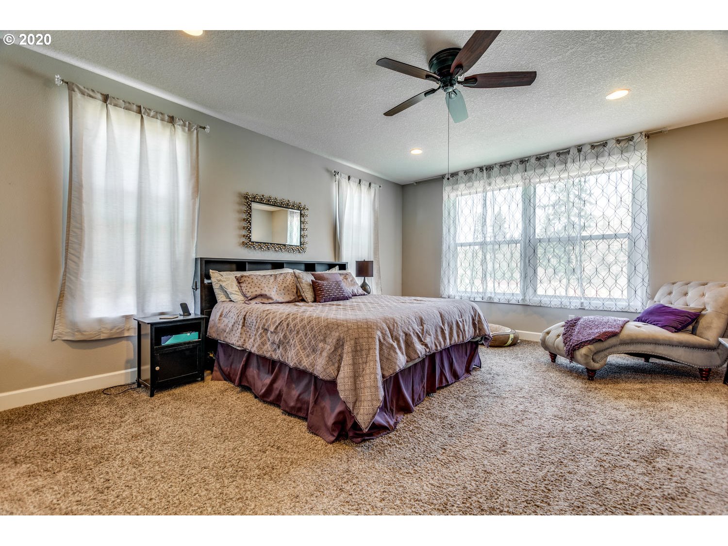 1704 Northwest 179th Street Ridgefield, WA 98642 - Photo 19 of 28 a spacious bedroom with a bed and window