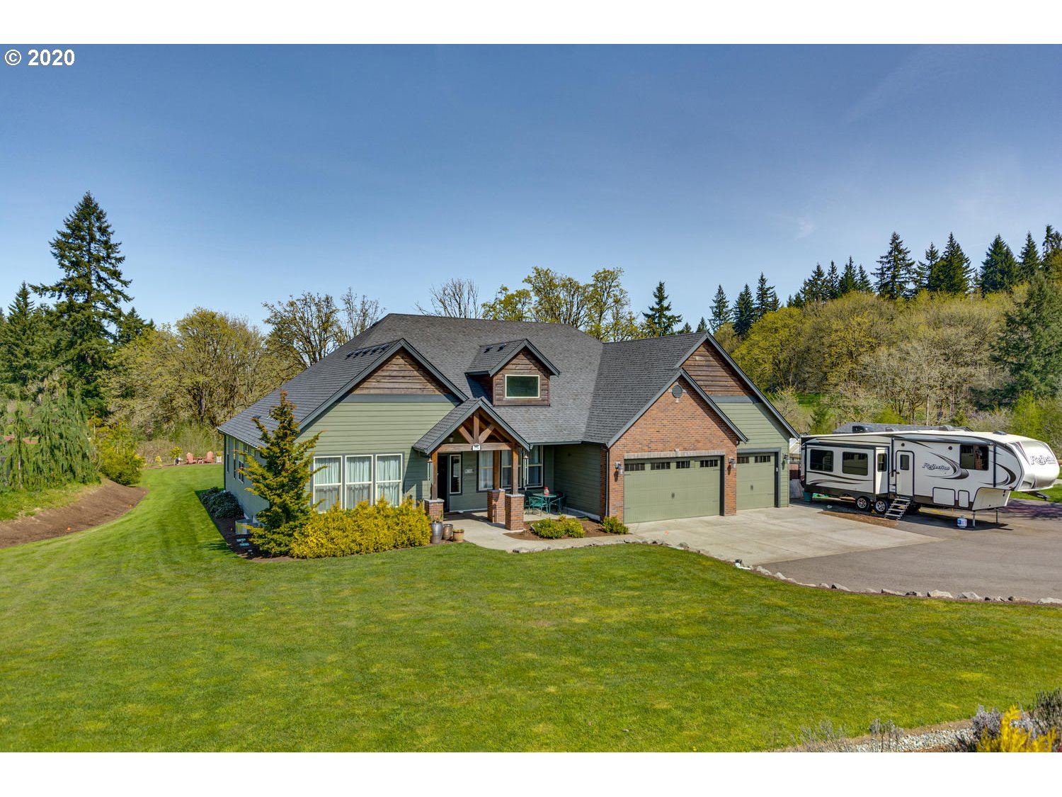 1704 Northwest 179th Street Ridgefield, WA 98642 - Photo 27 of 28 a house with garden in front of it