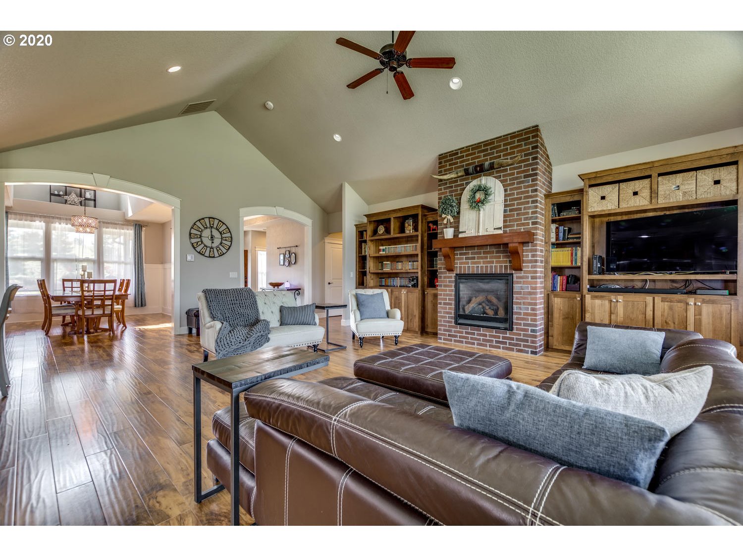 1704 Northwest 179th Street Ridgefield, WA 98642 - Photo 5 of 28 a living room with fireplace furniture and a flat screen tv