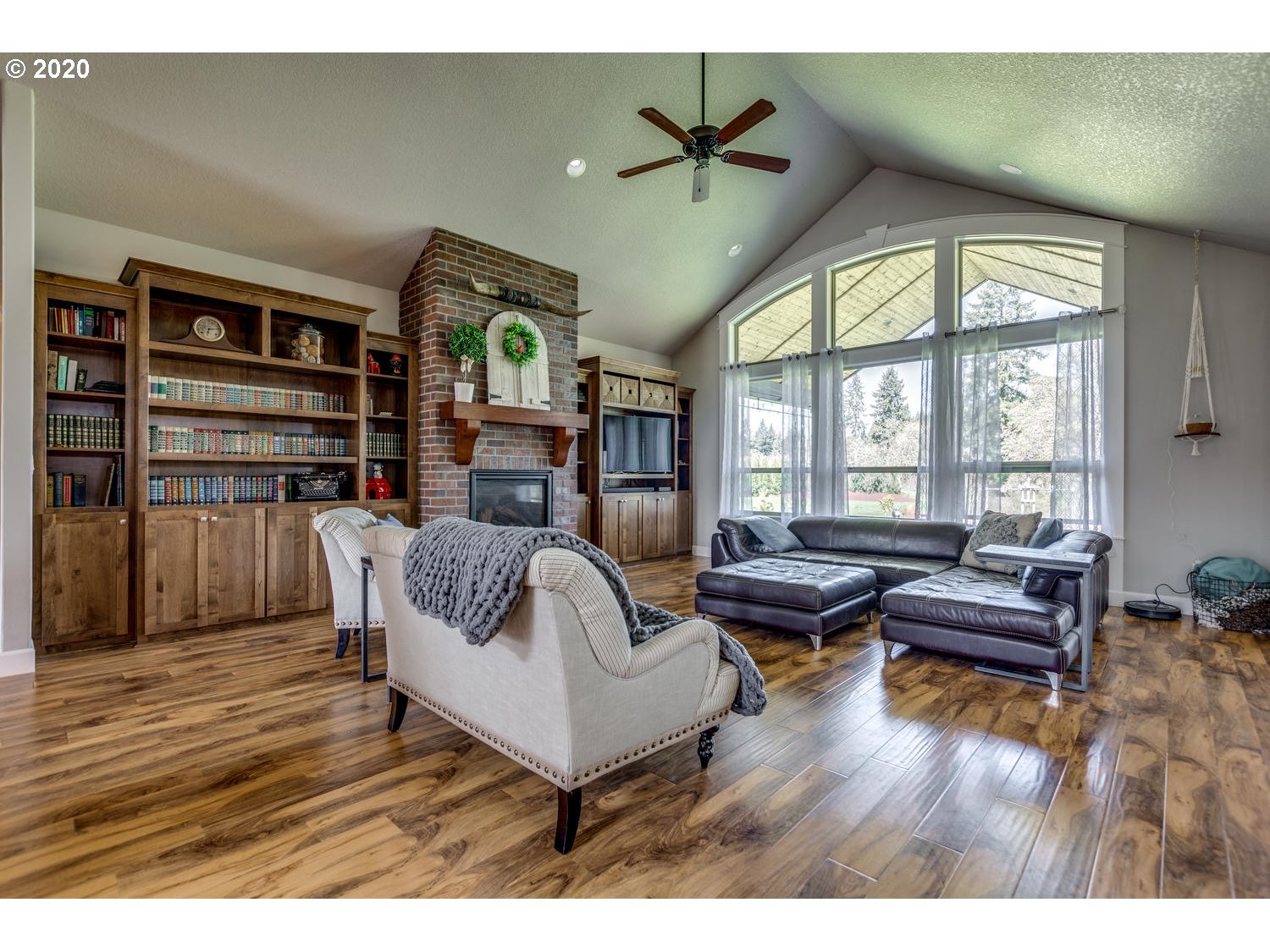 1704 Northwest 179th Street Ridgefield, WA 98642 - Photo 6 of 28 a living room with furniture and a large window