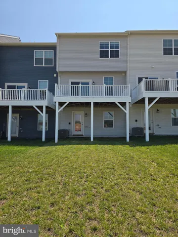 a front view of a building with garden