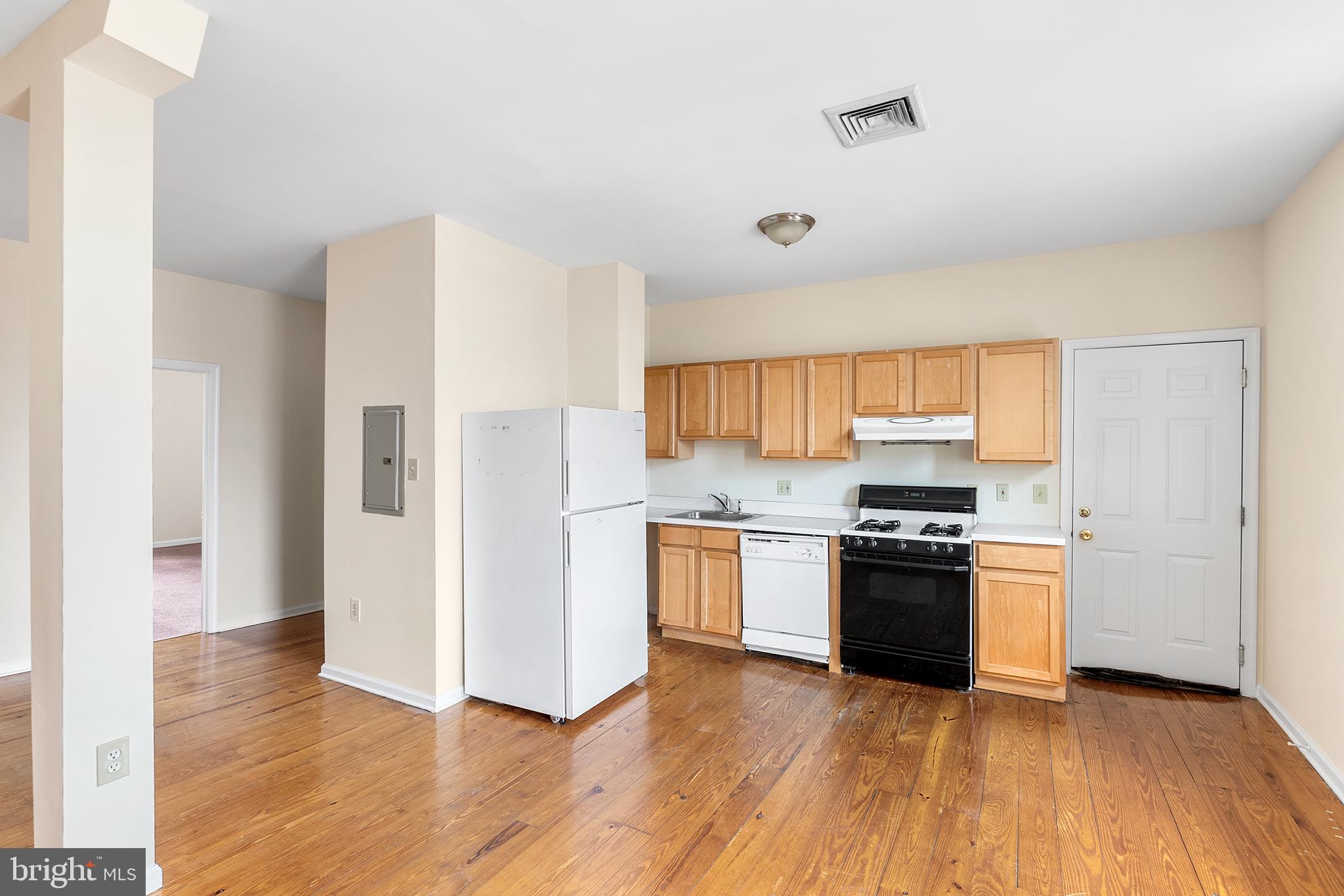 321-23 North Front Street, Unit 6 Philadelphia, PA 19106 - Photo 2 of 16 a kitchen with stainless steel appliances granite countertop a refrigerator stove and sink
