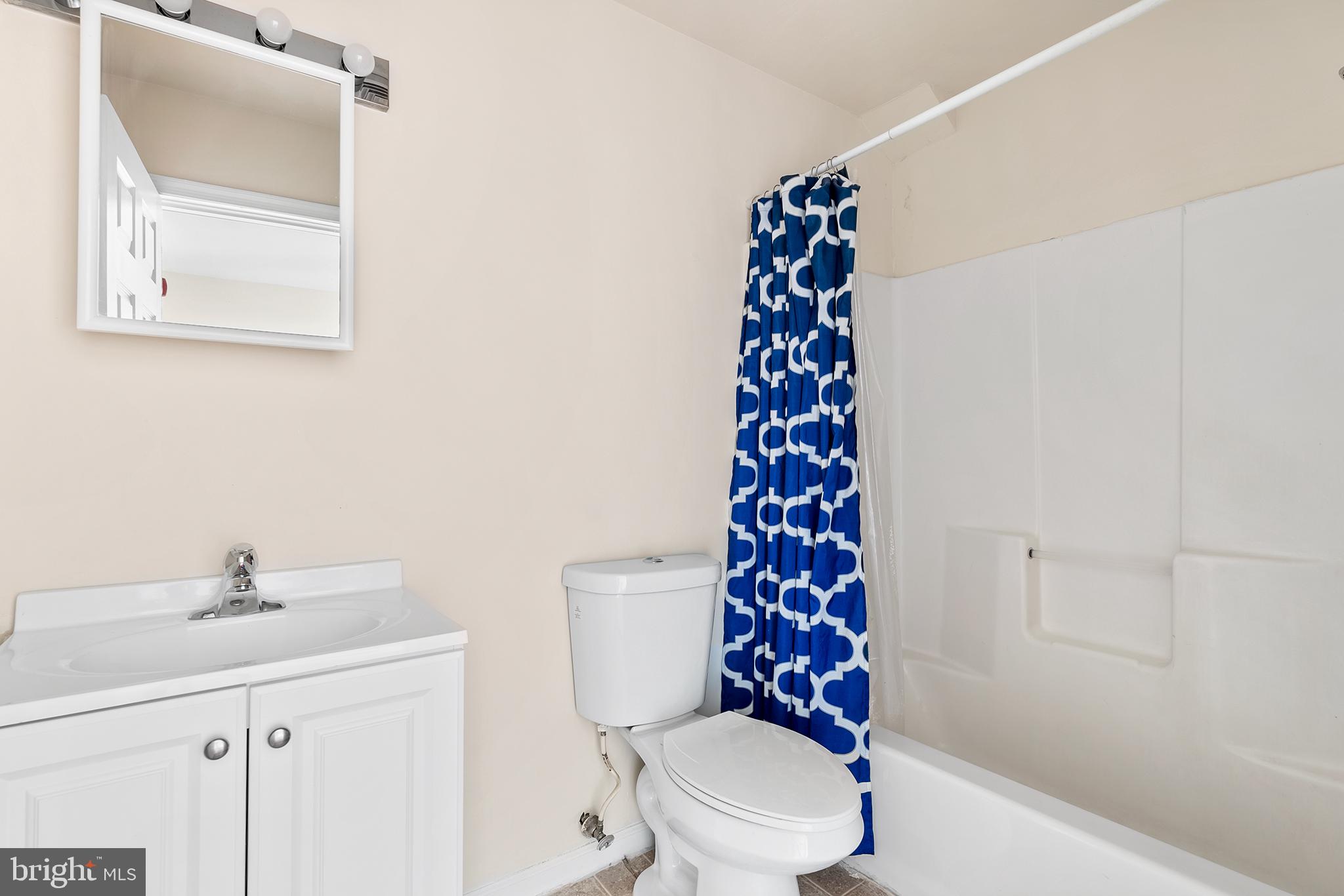 321-23 North Front Street, Unit 6 Philadelphia, PA 19106 - Photo 8 of 16 a white toilet sitting next to a bathroom sink