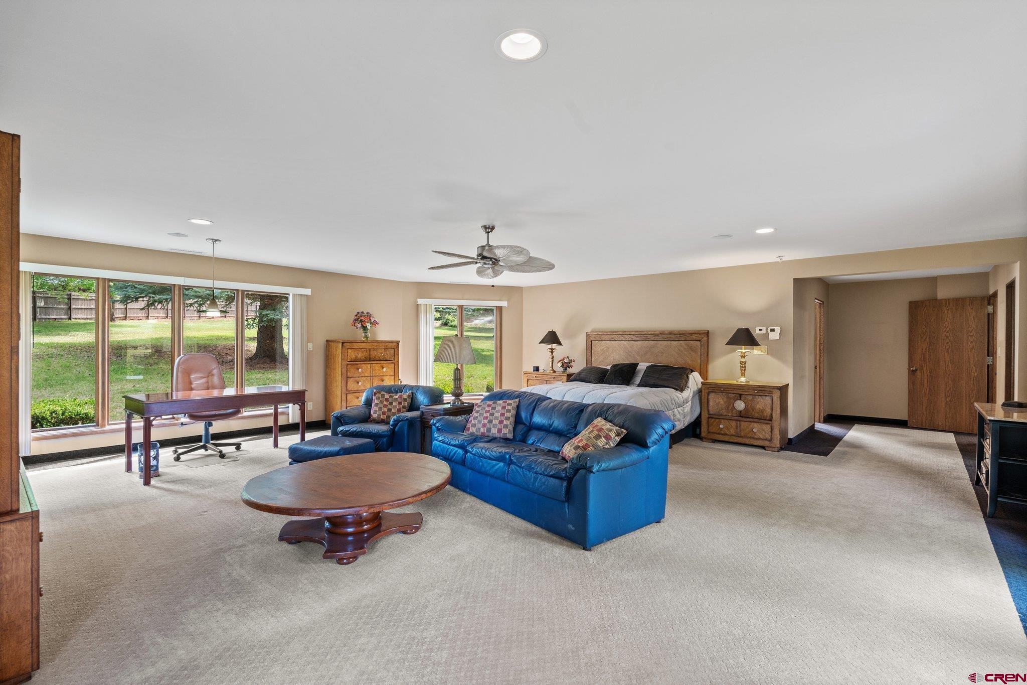 2565 County Road 250 Durango, CO 81301 - Photo 21 of 35 a living room with furniture a flat screen tv and a large window