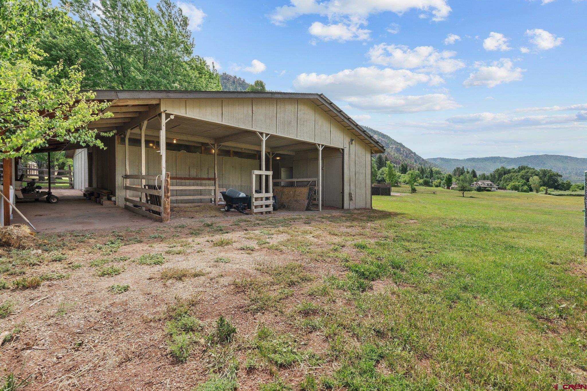 2565 County Road 250 Durango, CO 81301 - Photo 30 of 35 a view of a house with backyard porch and garden