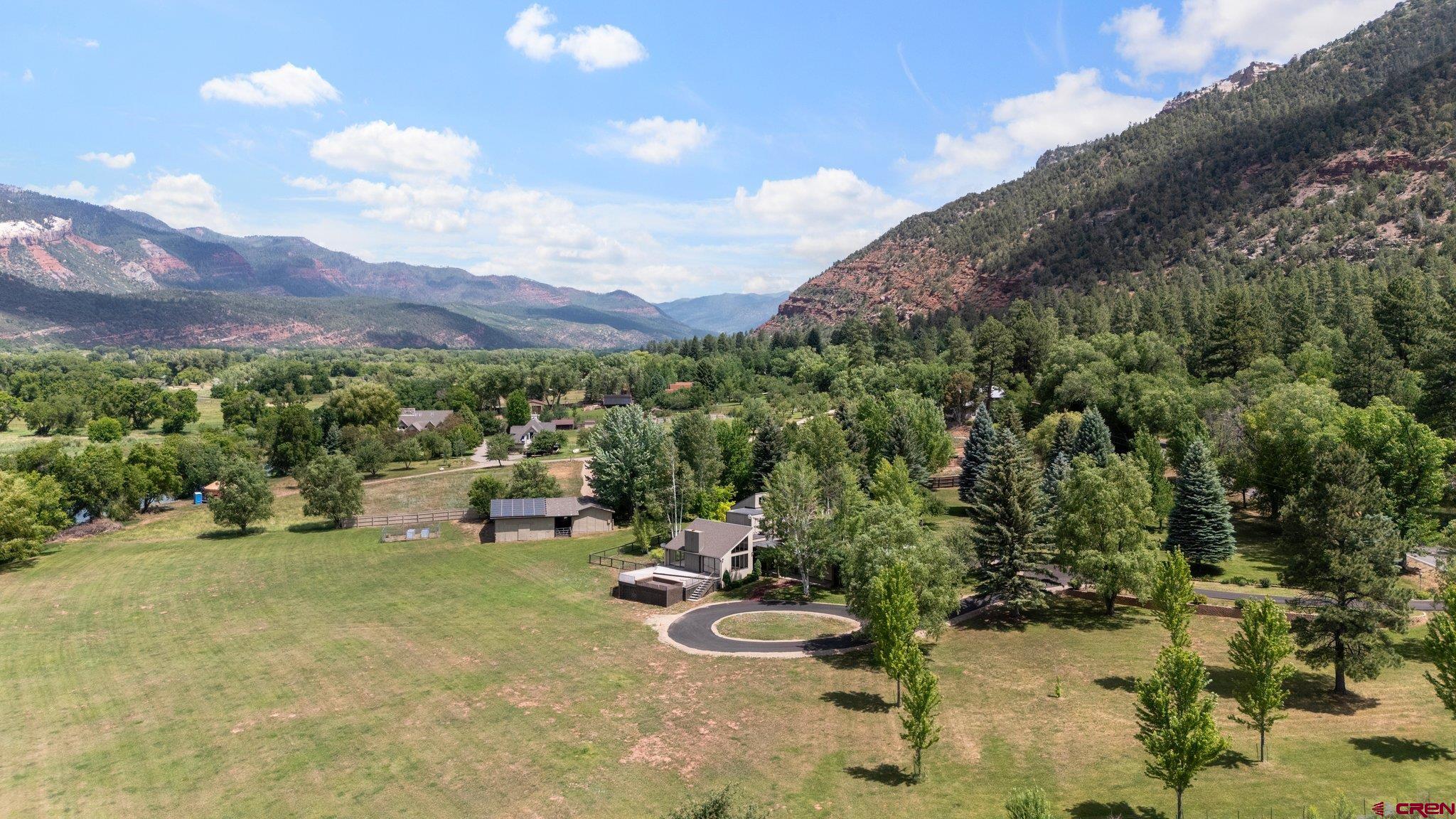 2565 County Road 250 Durango, CO 81301 - Photo 8 of 35 a view of a terrace with a garden and bench