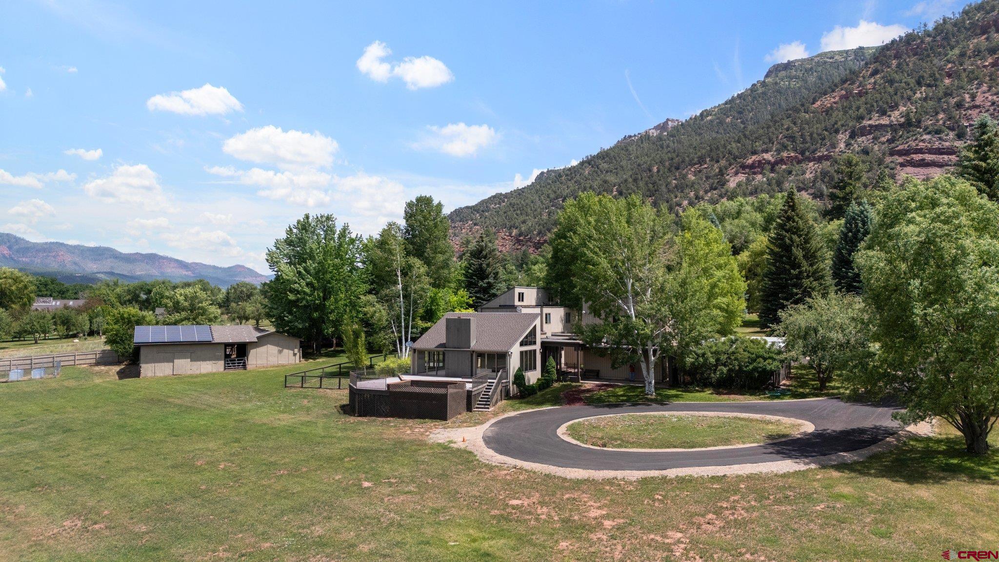 2565 County Road 250 Durango, CO 81301 - Photo 10 of 35 a backyard of a house with yard and outdoor seating