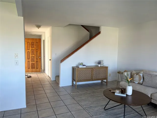 a room with furniture and wooden floor
