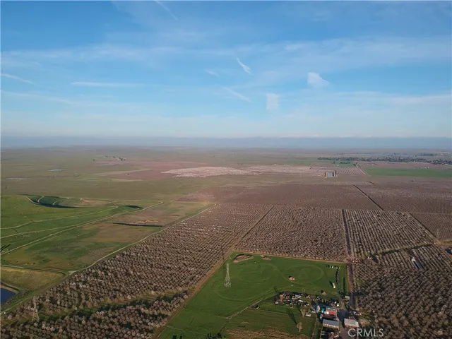 a view of a field with ocean view