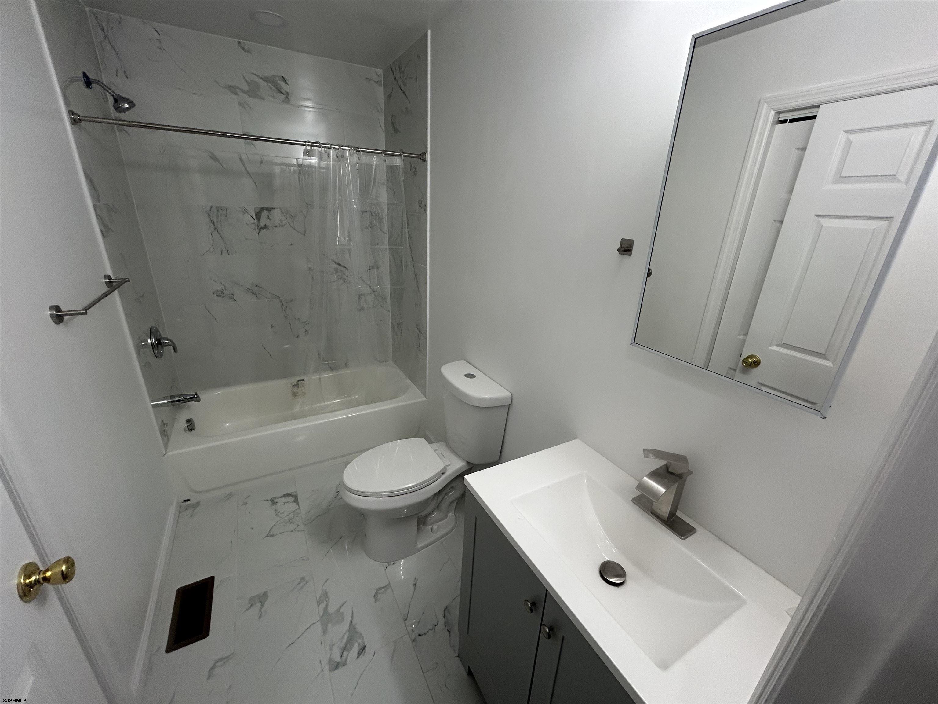 2821 Arctic Avenue, Unit 1 Atlantic City, NJ 08401 - Photo 9 of 10 a bathroom with a sink toilet and shower