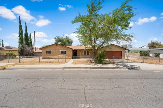 a front view of a house with yard