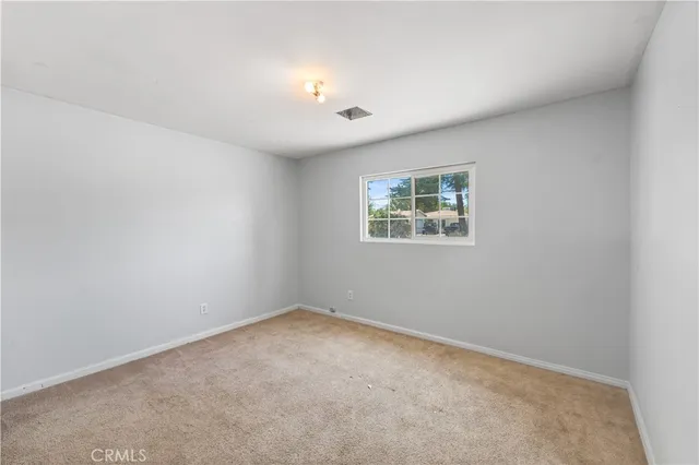 a view of walk in closet with cabinet