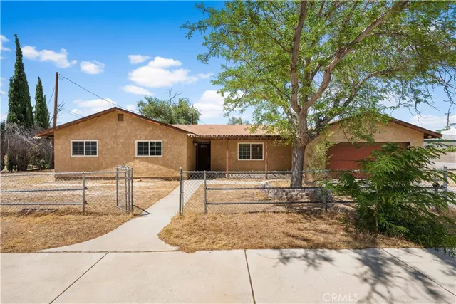 a view of house with backyard and swimming pool
