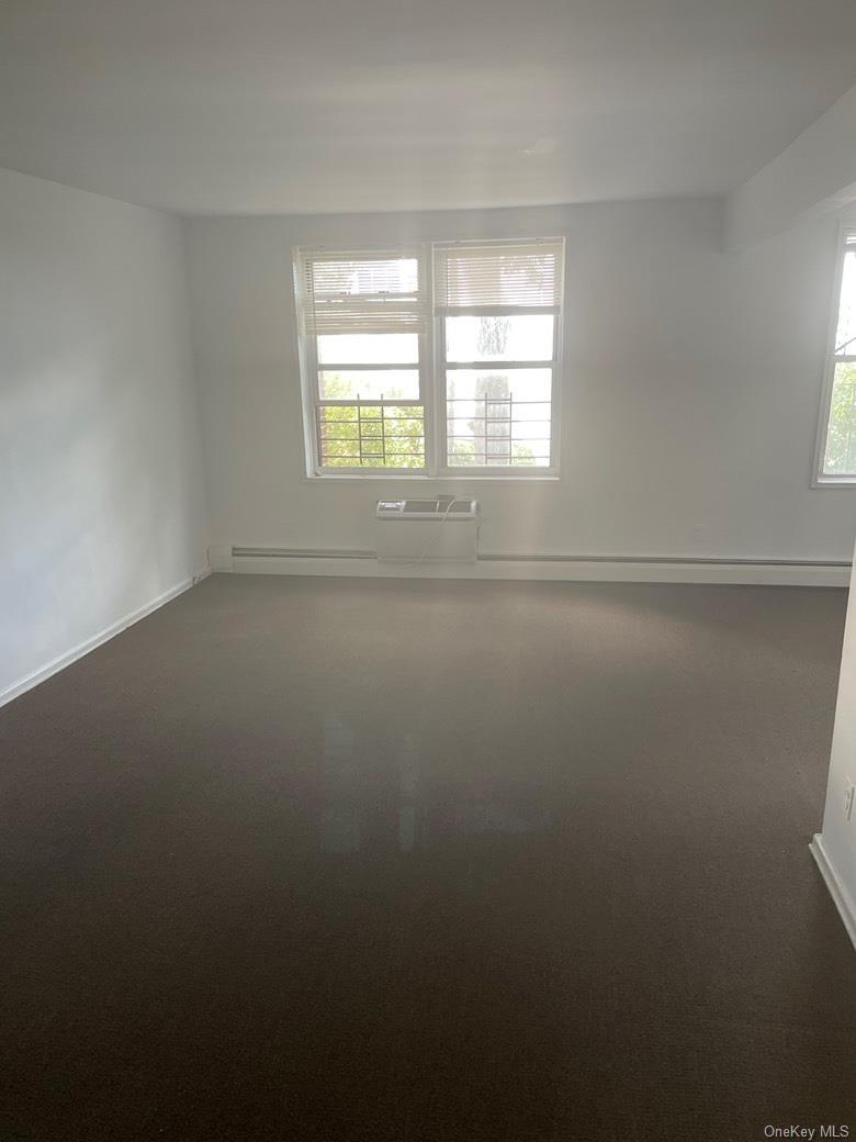 151-05 Cross Island Parkway, Unit 2F Queens, NY 11357 - Photo 12 of 16 a view of an empty room with a window