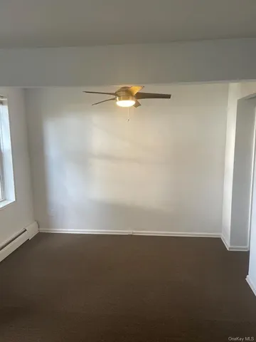 a view of a bathroom from a corridor