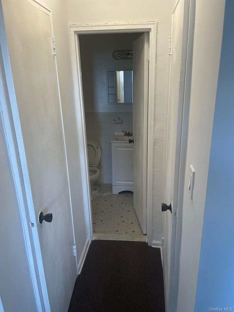 151-05 Cross Island Parkway, Unit 2F Queens, NY 11357 - Photo 14 of 16 a view of a bathroom from a corridor