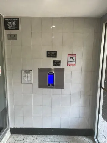 a bathroom with a shower and a sink