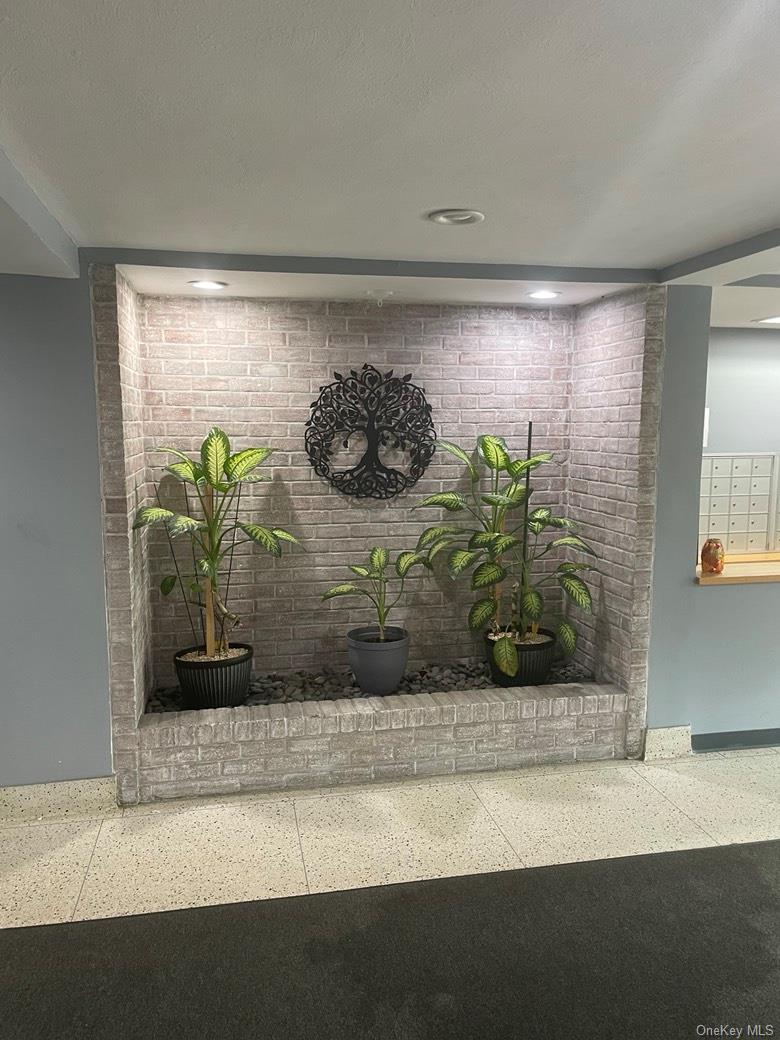 151-05 Cross Island Parkway, Unit 2F Queens, NY 11357 - Photo 5 of 16 a vase of flowers sitting on a table