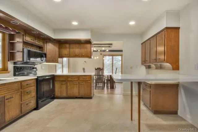 a kitchen with sink cabinets and window