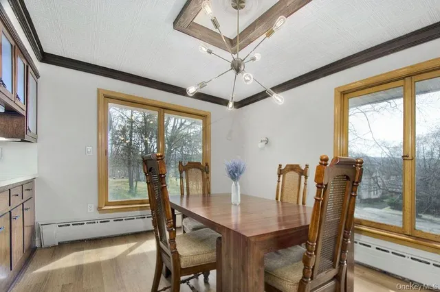 a view of a dining room with furniture window and outside view
