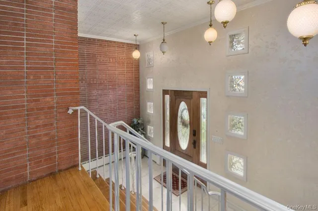 a view of entryway with wooden floor