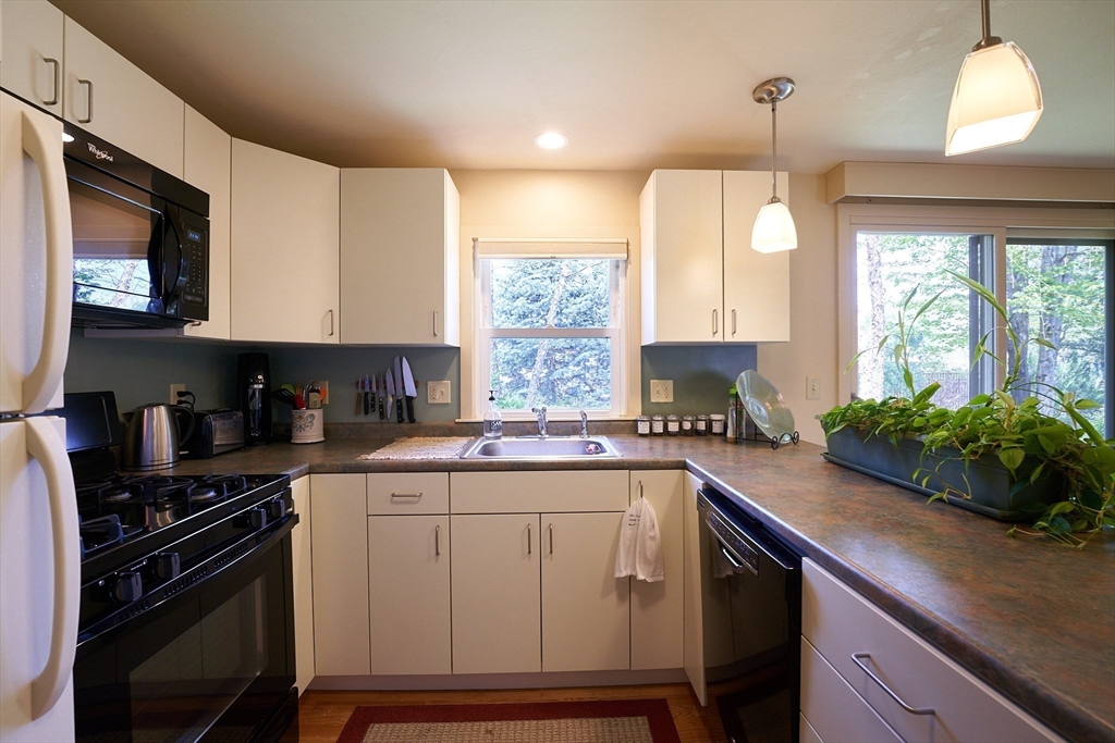 48 Sterling Road Northampton, MA 01062 - Photo 12 of 42 a kitchen with a sink stove and microwave