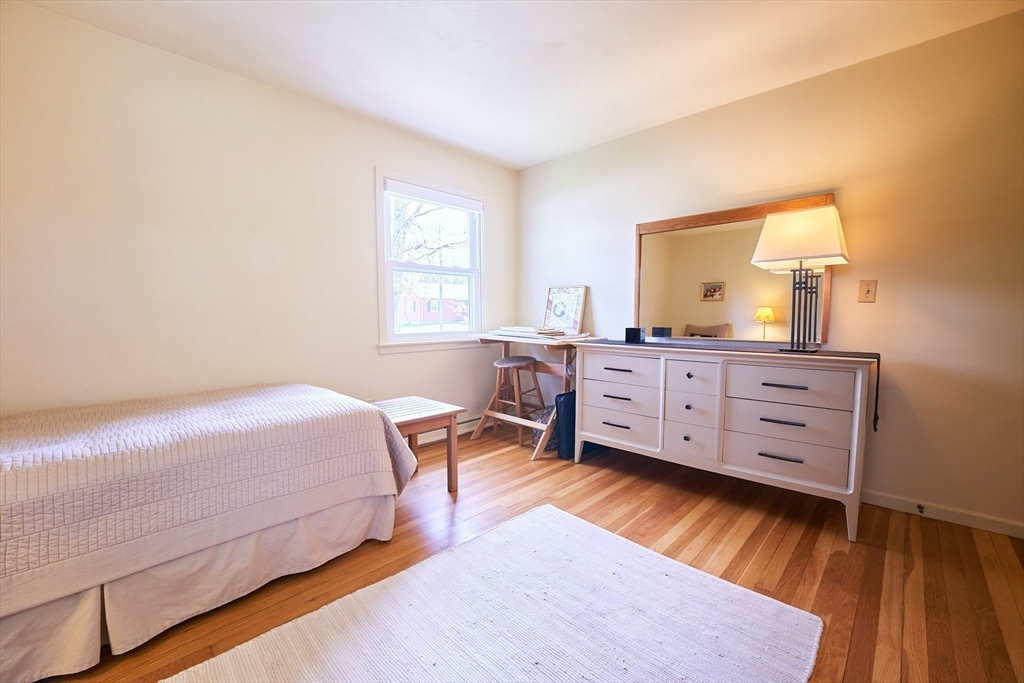 48 Sterling Road Northampton, MA 01062 - Photo 17 of 42 a bed room with a bed window and a chair