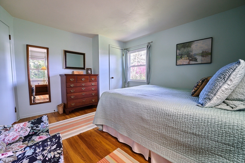 48 Sterling Road Northampton, MA 01062 - Photo 27 of 42 a bedroom with a bed window and a flat screen tv