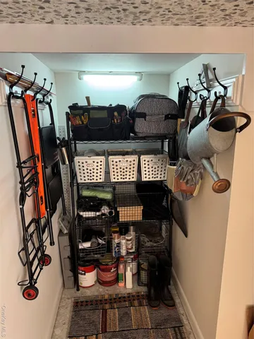 a bedroom with a bed a table and a window