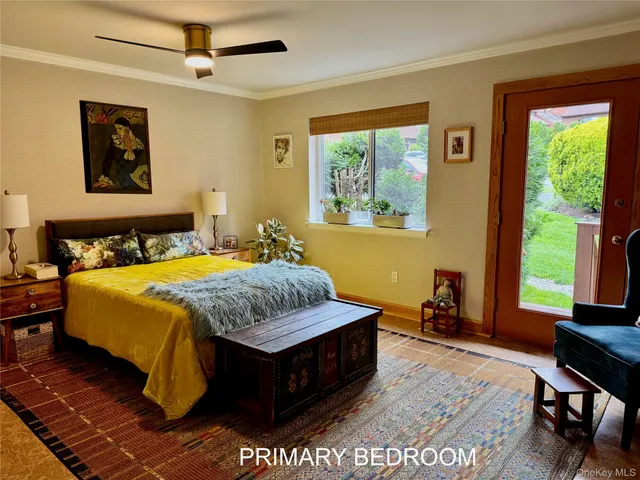 a room with mirror and a rug